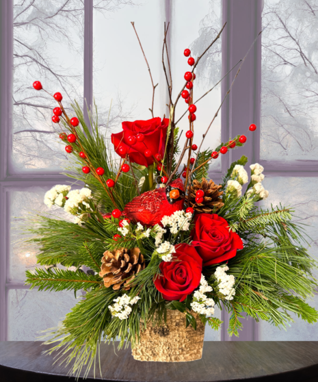 red and white floral arrangement accented with pinecones